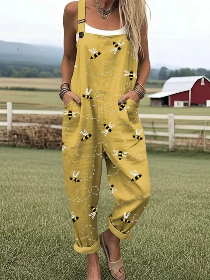 Calliope mouwloze damesjumpsuit in tuinbroekstijl met bijenprint