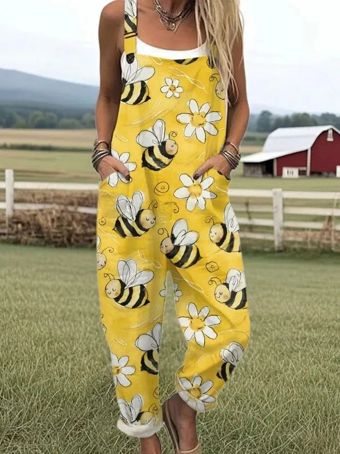 Calliope mouwloze damesjumpsuit in tuinbroekstijl met bijenprint