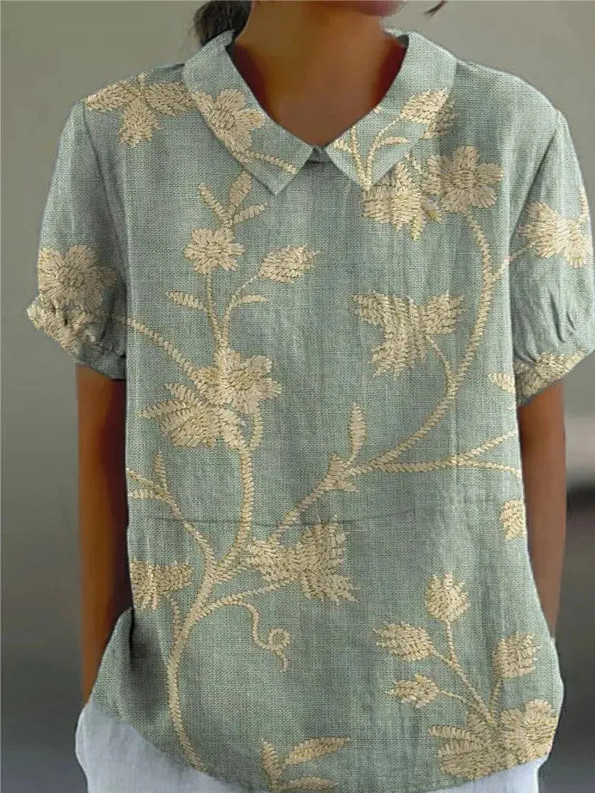 Damesblouse met geborduurde bloemen, kraag en korte mouwen