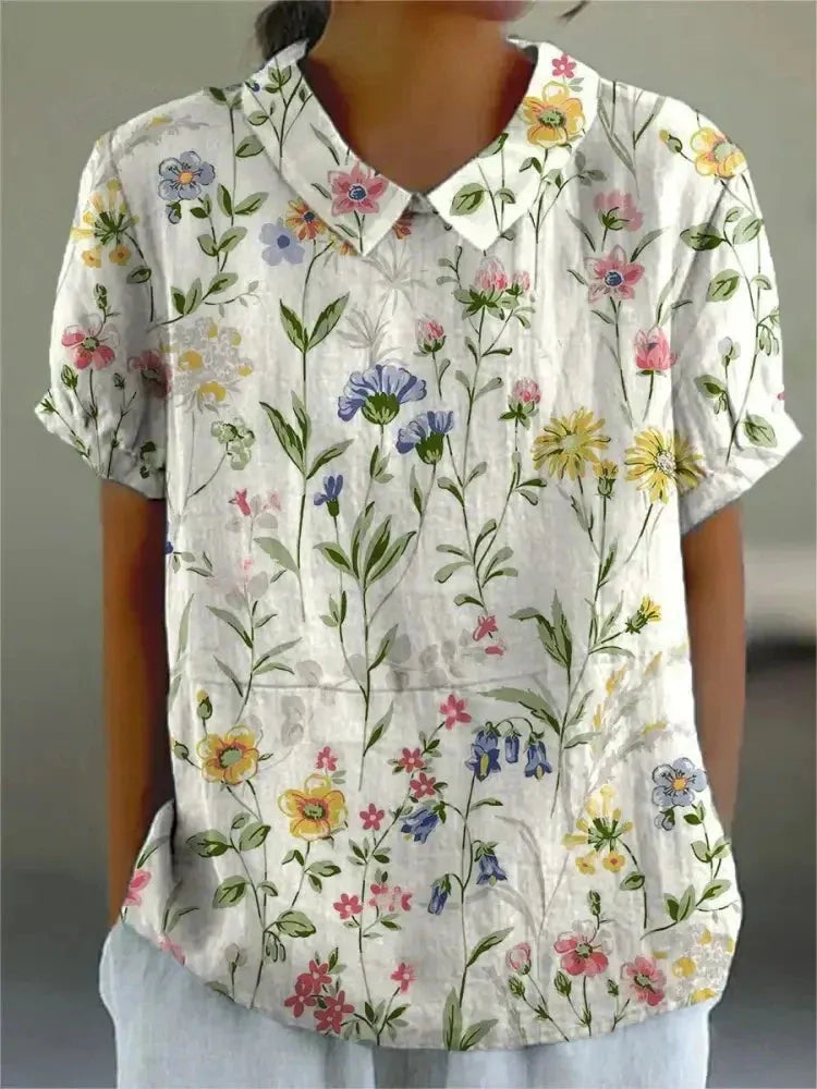 Damesblouse met geborduurde bloemen, kraag en korte mouwen