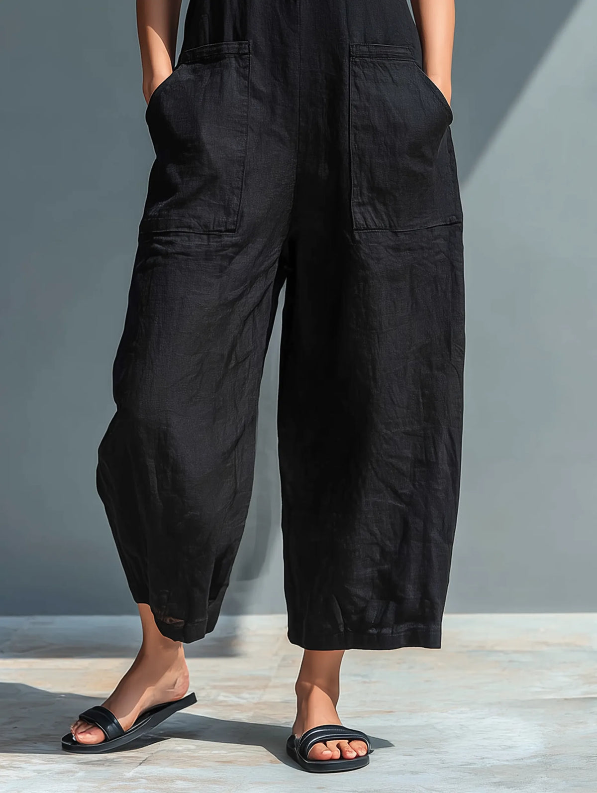 Lucinda mouwloze damesjumpsuit met wijde pijpen