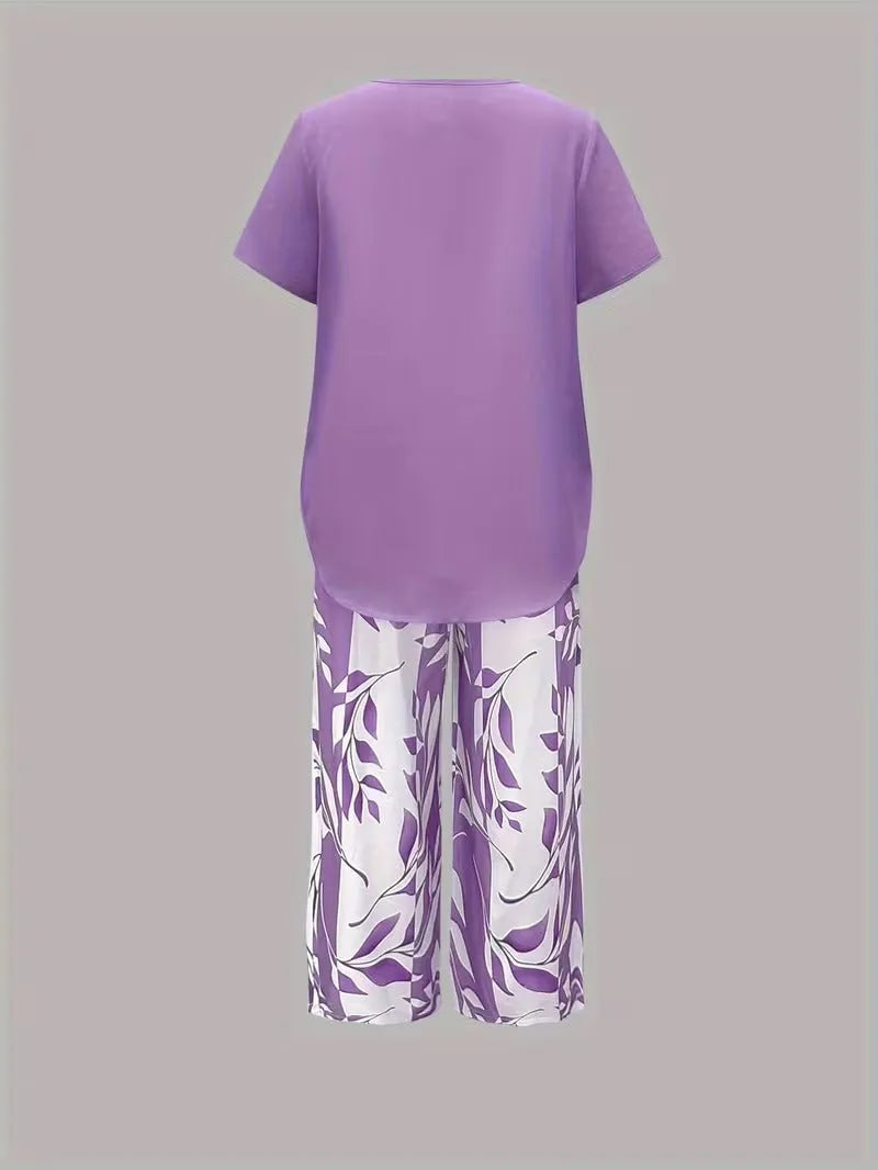Primrose tweedelige damesset met verkorte capribroek en bladerenprint