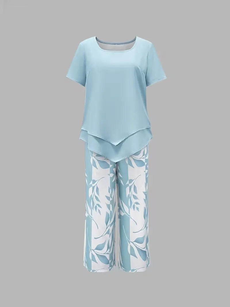 Primrose tweedelige damesset met verkorte capribroek en bladerenprint
