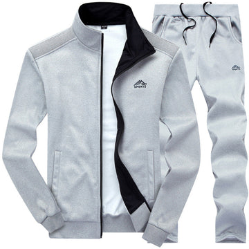 https://cdn.shopify.com/s/files/1/0659/5451/2986/files/stijlvol-gevoerd-heren-trainingspak-voorzijde-met-kraag-en-uitstekende-pasvorm-blauw-donkergrijs-of--1.jpg?v=1753581044
