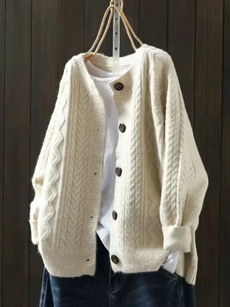 Oversized kabelbreivest met knopen